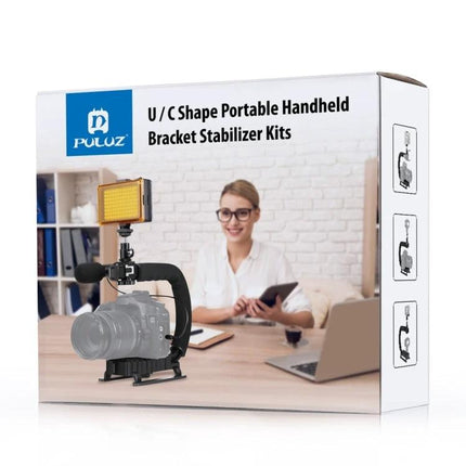 PULUZ C-Shaped Handheld Camera Stabilizer for Video Recording shown mounted with camera and LED light on desktop