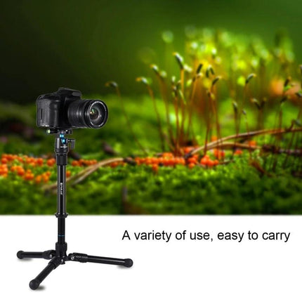 PULUZ Adjustable Metal Handheld Tripod Mount for DSLR and SLR Cameras shown supporting a DSLR for outdoor macro photography, compact and easy to carry