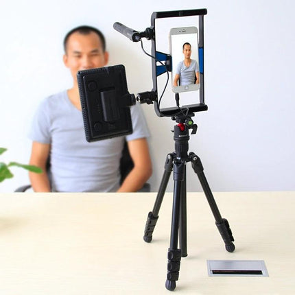 PULUZ Metal Tripod with Adjustable Height for Cameras set up with phone and LED light for indoor video shoots