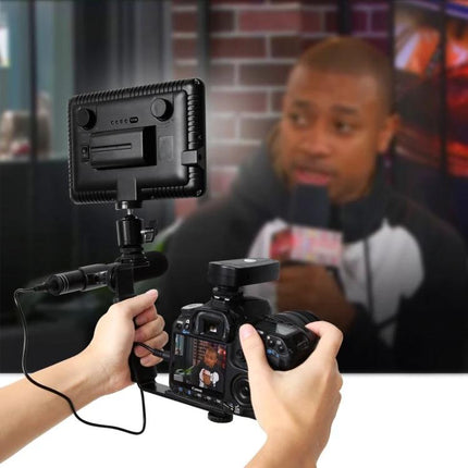 PULUZ Microphone for Everyday Video and Interview Recording attached to DSLR setup capturing a field interview