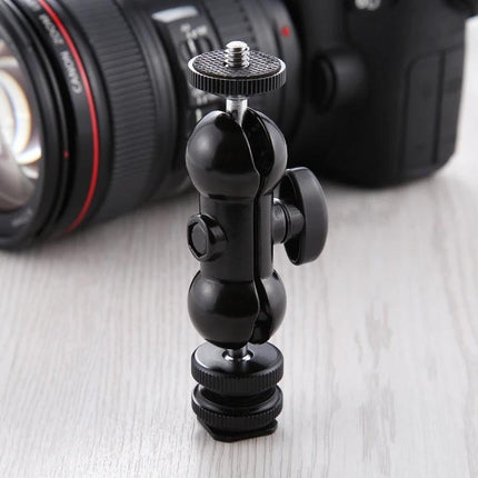 PULUZ Swivel Ball Head with Lock for Camera Tripods mounted on tabletop next to DSLR, adjustable angle and accessory mount