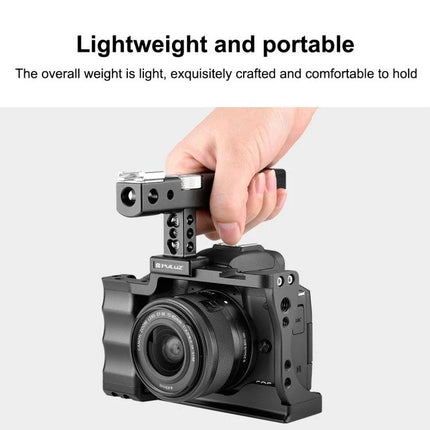 PULUZ Video Camera Stabilizer Cage with Comfort Grip Handle held by hand showing lightweight portable aluminum cage for mirrorless camera