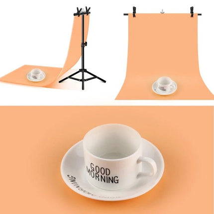 T-Shape Adjustable Background Support Stand for Photo Studios holding peach backdrop with cup and saucer for product photography
