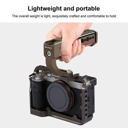 PULUZ Wooden Top Handle for Mirrorless Cameras with Cold Shoe Mount held on a mirrorless camera to show lightweight portable grip and accessory mounting
