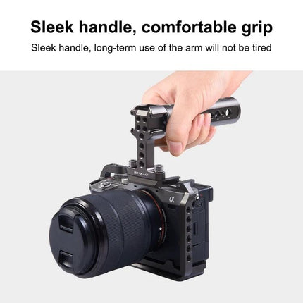 PULUZ Handheld Camera Stabilizer Handle with Accessory Mounts shown attached to mirrorless camera with sleek comfortable grip and three cold shoe mounts