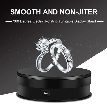 PULUZ 15cm Adjustable Speed Rotating Display Turntable Stand showing black rotating display with diamond rings for jewelry showcase
