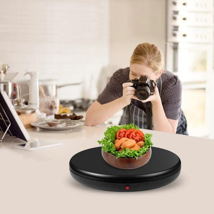 PULUZ 45cm Remote Control Rotating Display Stand for Showcasing Items showing food photography setup on black rotating turntable with remote control