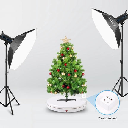 PULUZ White 45cm Rotating Display Stand for Showcasing Items with Christmas tree on electric turntable under studio lights