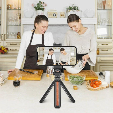 PULUZ Aluminum Alloy Phone Holder for Tripods with Accessory Mount securing smartphone on tabletop tripod for cooking vlog with two women filming