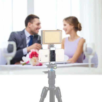 PULUZ Universal Aluminum Phone Clamp Holder with Cold Shoe Mount securing smartphone on tripod with LED light for vlogging and live streaming
