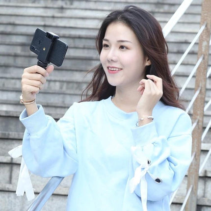 PULUZ Tripod for Everyday Phone Photography and Travel Moments – woman doing a hands-free selfie with phone mounted on compact tripod
