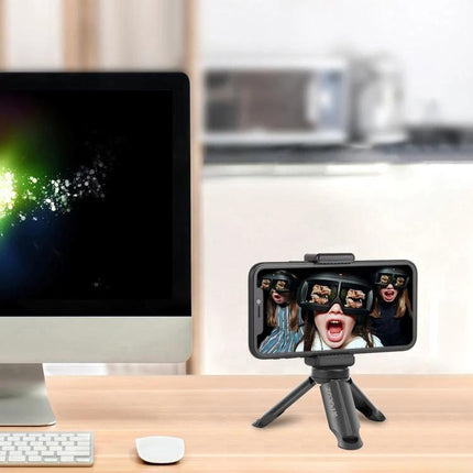Portable Mini Tripod with Clamp for Smartphone Stability on desk holding phone for selfies and video calls