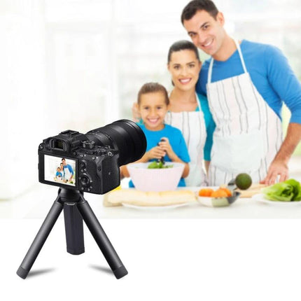 PULUZ Compact Metal Desktop Tripod for Travel Photography showing camera on tripod capturing family cooking scene