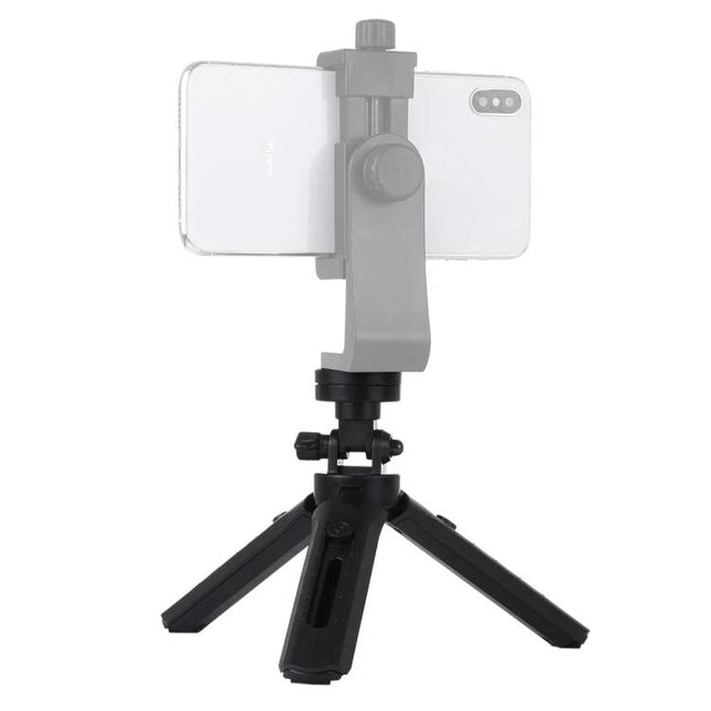 PULUZ Adjustable Desktop Tripod for Digital Cameras holding a smartphone on compact tabletop tripod with telescopic height adjustment