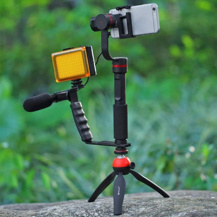 PULUZ Pocket LED Light for Vlogging and Photography Sessions mounted on a smartphone gimbal with tripod and external mic for portable outdoor shooting
