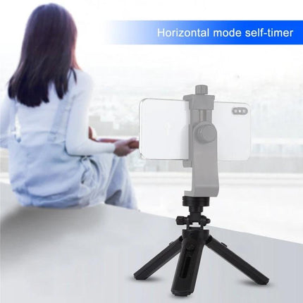 PULUZ Adjustable Desktop Tripod for Digital Cameras holding smartphone on small tabletop tripod for steady horizontal shots