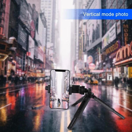 PULUZ Adjustable Desktop Tripod for Digital Cameras holding a smartphone on a tripod in vertical mode for stable street photography