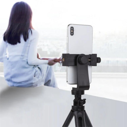PULUZ 360-Degree Rotating Universal Phone Clamp Holder for Smartphones mounted on tripod holding smartphone for content creators