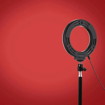 PULUZ LED Ring Light for Everyday Video and Photo Use on stand against red backdrop, portable adjustable even lighting