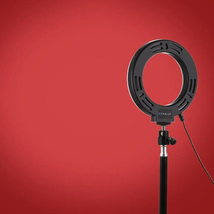 PULUZ LED Ring Light for Daily Video and Photo Essentials on stand with cord against red background