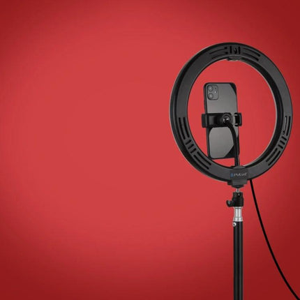 PULUZ Ring Light for Everyday Home Video and Photo Sessions mounted with smartphone on stand against red background