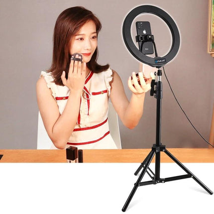 PULUZ 1.6m Adjustable Tripod for Vlogging and Live Streaming with ring light and phone holder shown during makeup tutorial