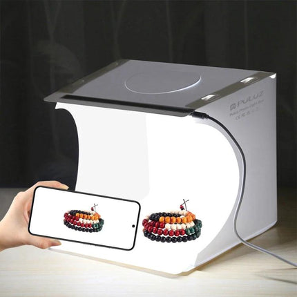 PULUZ Portable 20cm Folding Light Box for Product Photography showing jewelry photographed inside with smartphone