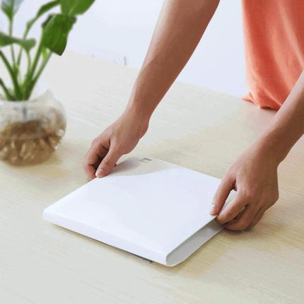 PULUZ Portable 20cm Folding Light Box for Product Photography - compact white folding light box being set up on a table for small product shoots
