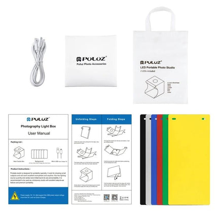 PULUZ Portable Folding Light Box for Small Item Photography accessories kit laid out with cords, carry bag, manual and colored backdrops