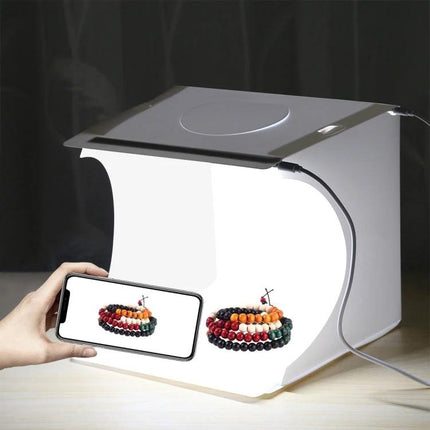 PULUZ Portable Folding Light Box for Small Item Photography showing a bracelet photographed inside with smartphone capture