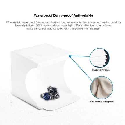 PULUZ Portable Folding Light Box for Small Item Photography showing white folding light tent with watches inside and callouts to waterproof anti-wrinkle PP fabric