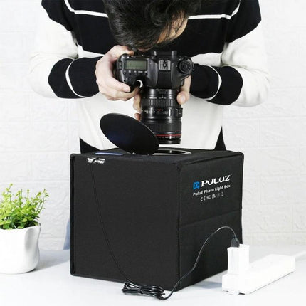 PULUZ 25cm Folding Portable Light Box for Small Item Photography - photographer shooting jewelry and gadgets with compact foldable cube