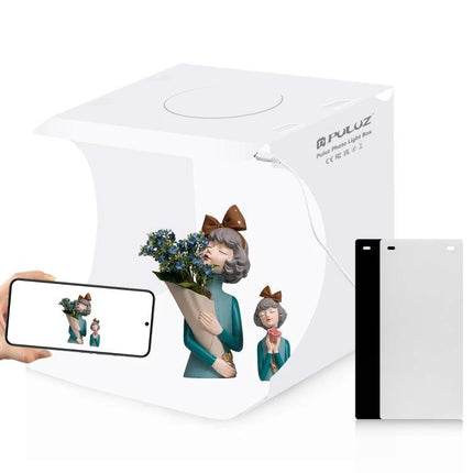 PULUZ Folding Portable Light Box for Small Item Photography showing compact white foldable studio with figurine and smartphone setup