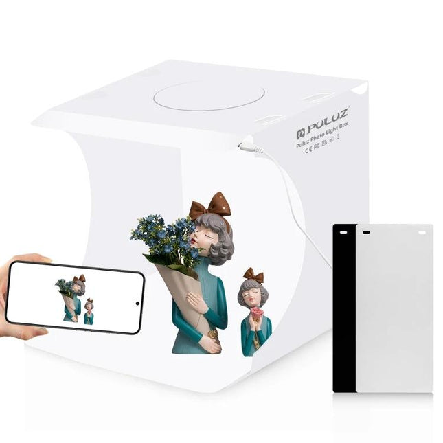 PULUZ Folding Portable Light Box for Small Item Photography showing compact white foldable studio with figurine and smartphone setup