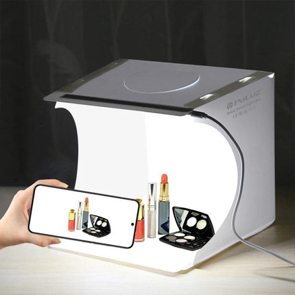PULUZ Folding Portable Light Box for Small Item Photography showing compact studio photographing cosmetics with smartphone