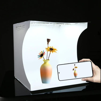 PULUZ 30cm Folding Light Box Kit for Small Product Photography shooting a vase with flowers on white backdrop for e-commerce