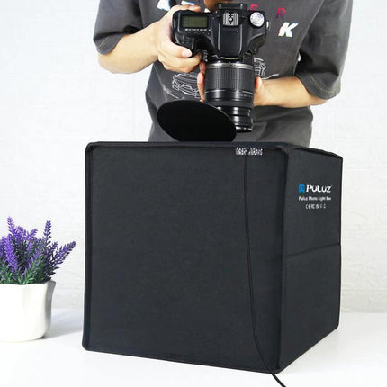 PULUZ 30cm Folding Photo Box for Product Shooting with Backdrops showing camera shooting a small product in black foldable light box