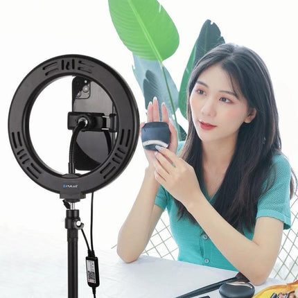 PULUZ LED Ring Light for Everyday Video and Photo Use showing woman using ring light for makeup tutorial and improved skin tones