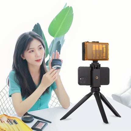 PULUZ Pocket Mini Plastic Tripod with Smartphone Clamp set up for tabletop vlogging with smartphone and LED light