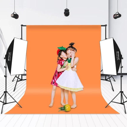 PULUZ Softbox and LED Light Kit for Studio Photography setup with orange backdrop and two children posed for portrait lighting