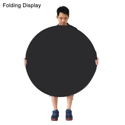 PULUZ 60cm 5-in-1 Folding Reflector for Photography held folded as a black circular disc by a model for compact storage