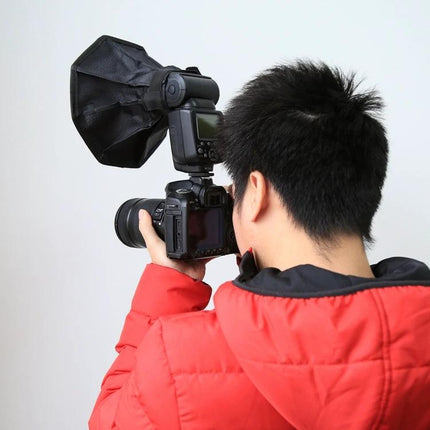 PULUZ 20cm Octangle Foldable Softbox for Flash Photography mounted on DSLR flash, photographer shooting indoor portrait to diffuse light and reduce harsh shadows
