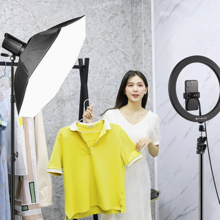 PULUZ 95cm Octagonal Parabolic Softbox for Photography Flash diffusing light on a model holding a yellow shirt in a studio