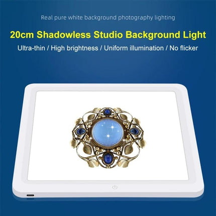PULUZ 20cm Shadowless Light Pad for Product Photography showing jewelry on an evenly lit white background
