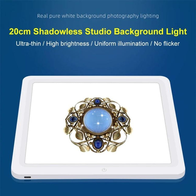 PULUZ 20cm Shadowless Light Pad for Product Photography showing jewelry on an evenly lit white background