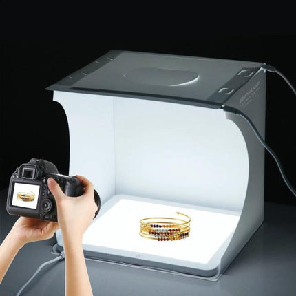 PULUZ Mini LED Light Box for Small Product Photography showing jewelry shot inside compact foldable studio
