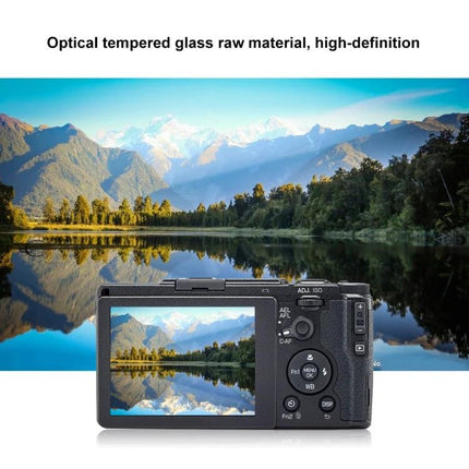 PULUZ 9H Tempered Glass Screen Protector for Digital Cameras installed on camera showing clear landscape reflection, anti-fingerprint, high-definition protection