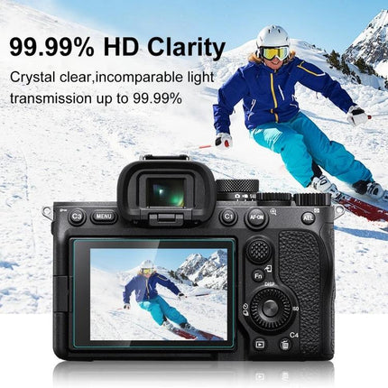 PULUZ Tempered Glass Screen Protector for Sony Alpha 7 IV Camera showing clear LCD display with skier reflection and 99.99% HD clarity