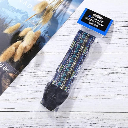 PULUZ Retro Ethnic Style Camera Strap for DSLR Cameras in blue geometric pattern packaged on white wood background