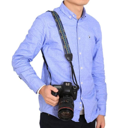 PULUZ Retro Ethnic Style Camera Strap for DSLR Cameras shown on photographer wearing blue shirt with DSLR hanging